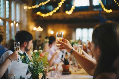 Guests toasting with champagne at a formal dinner